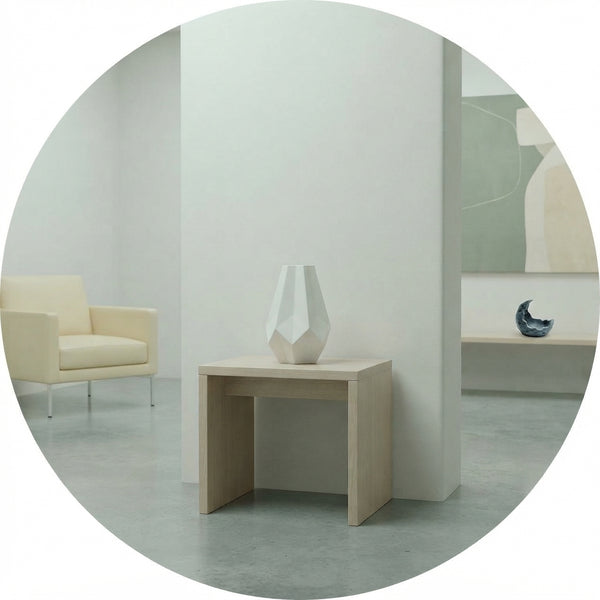 A sterile, minimalist living room corner with a lone vase, illustrating an empty and disconnected home environment.